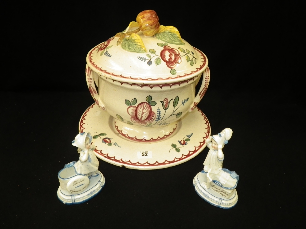A Continental hand painted pottery tureen and cover and a pair of Edwardian German fairings