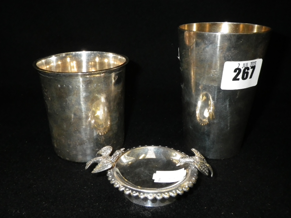 A Continental white metal salt, depicting birds drinking and two Continental white metal beakers