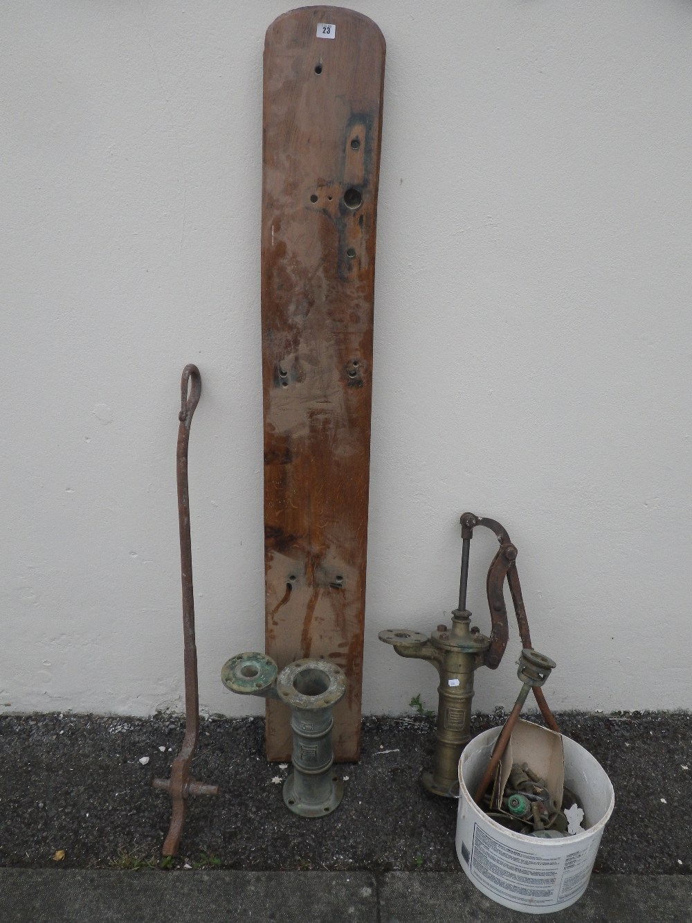 A brass water pump and other similar items