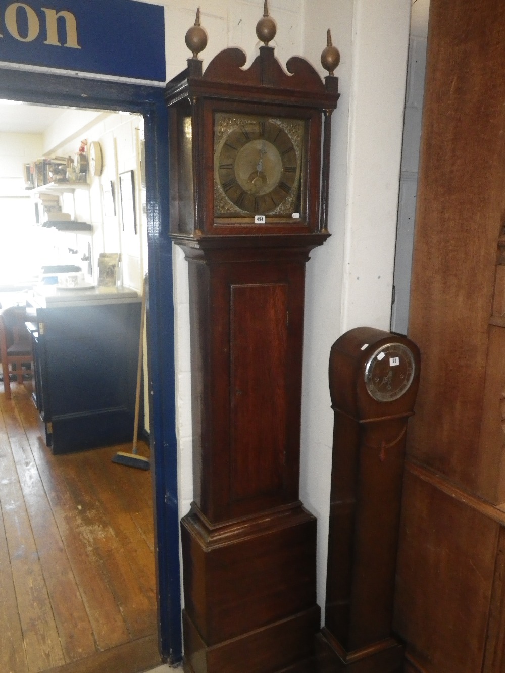 A brass dial 30 hour longcase clock, inscribed `Henderson, Hull` with oak (possibly later) case