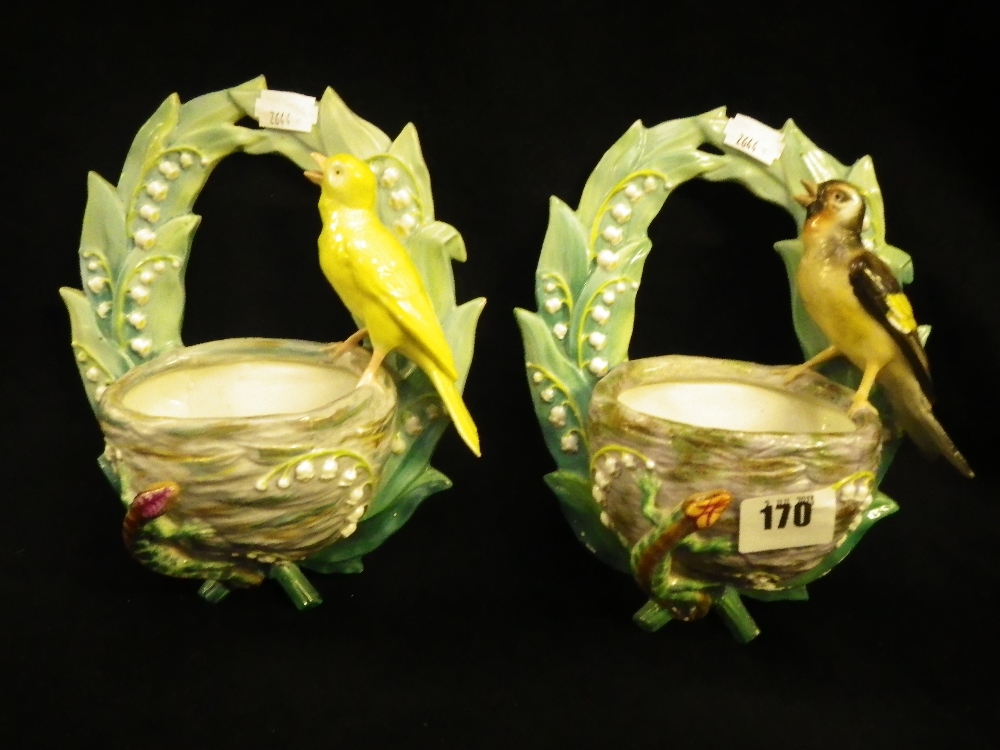 A pair of 19th century wall pockets with bird and lizard decoration