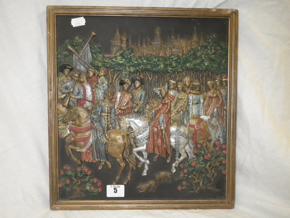 A coloured plaster bas- relief panel, depicting a medieval courtly scene