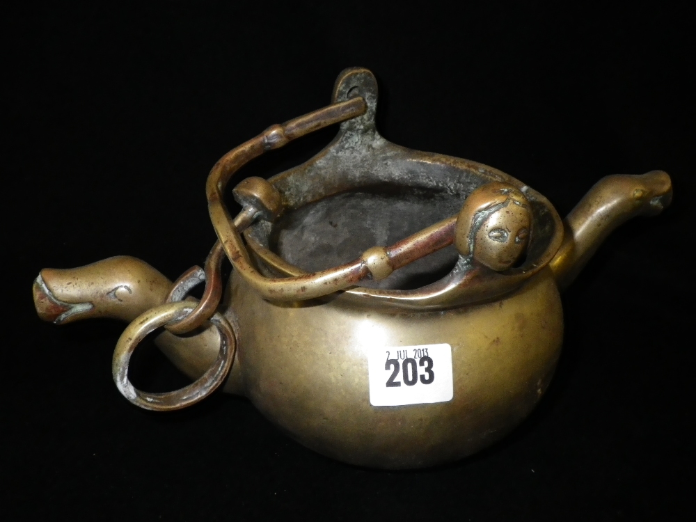 A cast pouring vessel with twin spouts and female head mounts