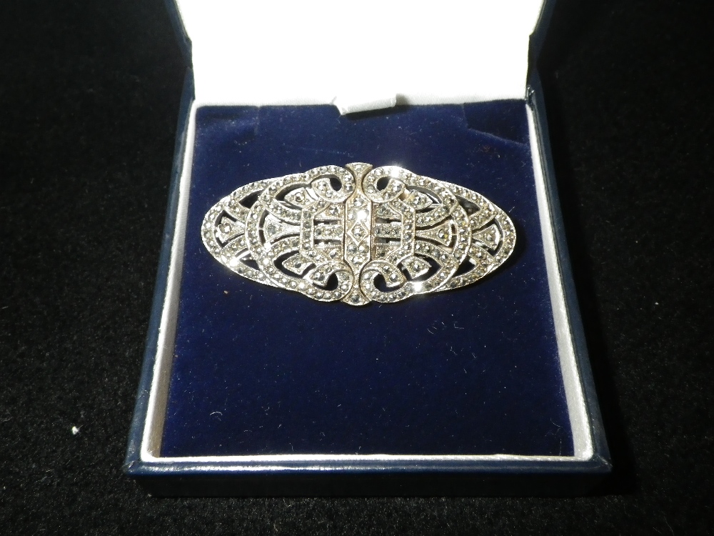 An oval Art Deco style marquisite brooch converting in to two clips