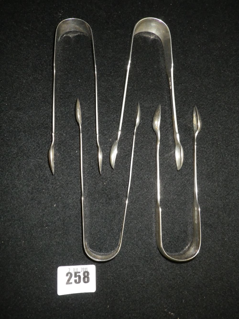 Four pairs of George III sugar tongs, various dates and makers