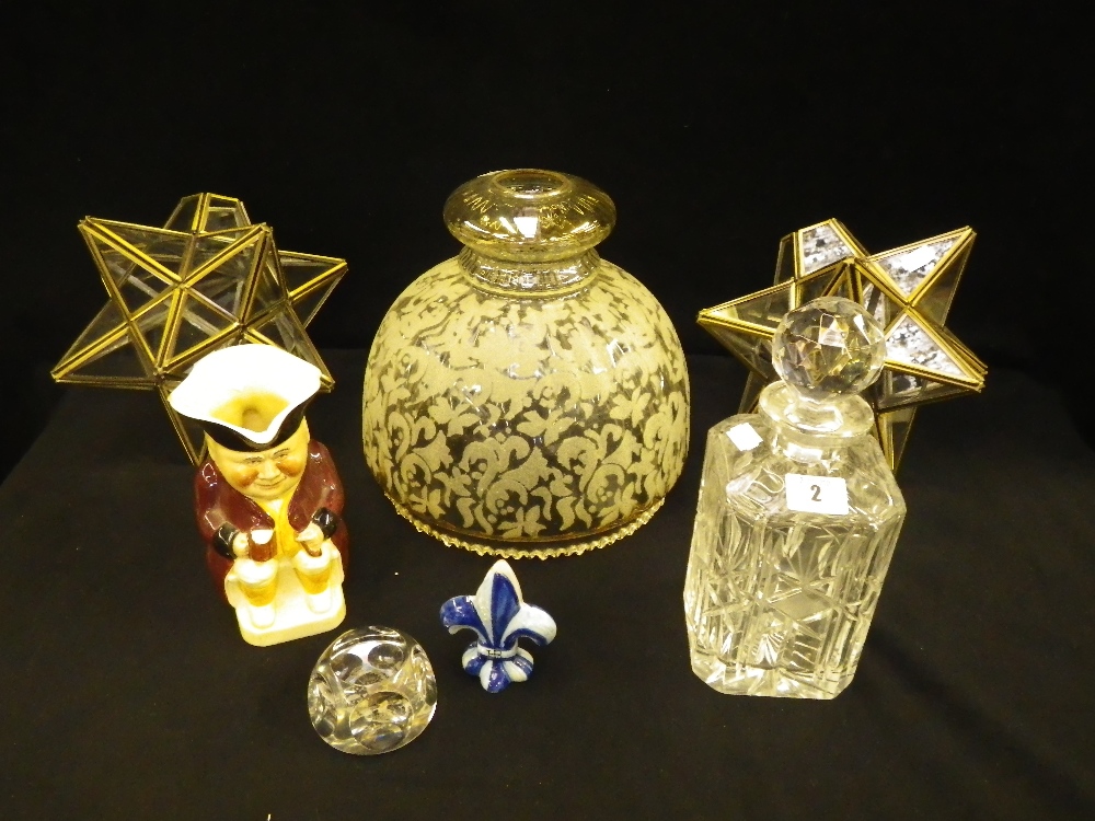 A pair of metal and glass star-shaped light fittings, a Tony Wood Toby jug, a cut-glass decanter and