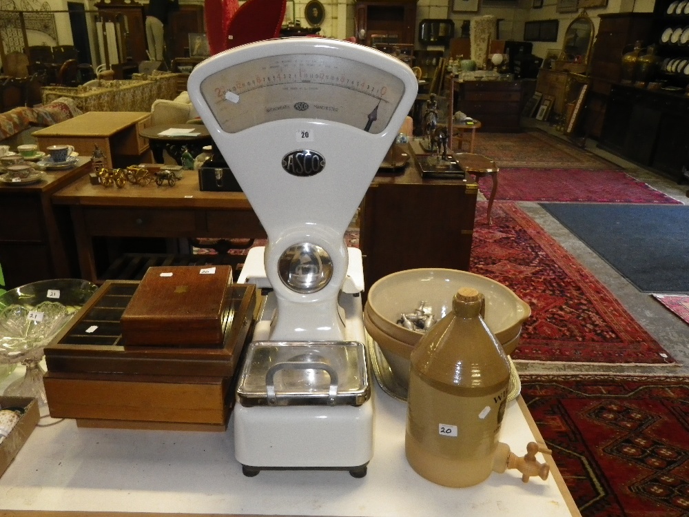 A set of Asco weighing scales, a collection of display cases, two mixing bowls and similar items