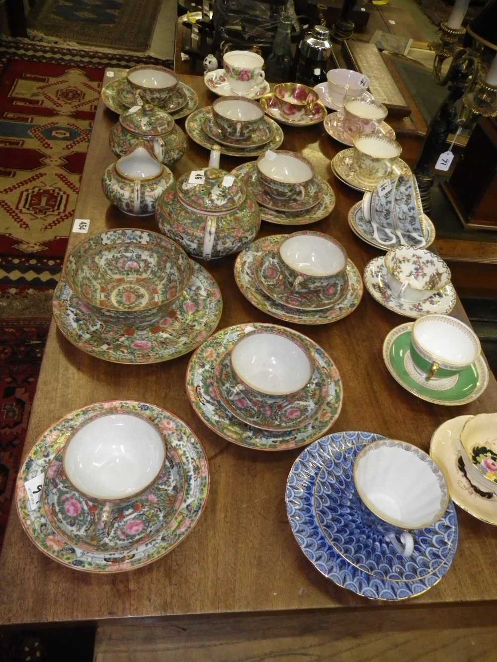 A collection of Chinese famille-verte teaware and a quantity of decorative tea cups and saucers