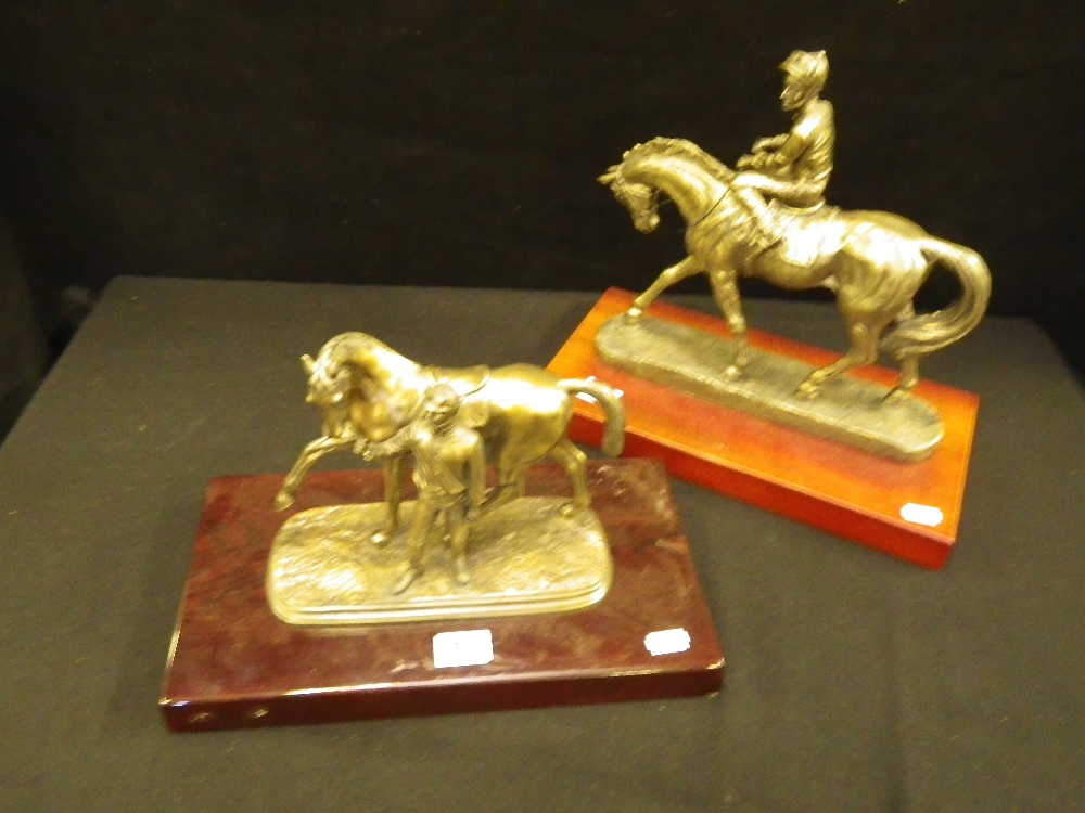 A bronze effect study of a racehorse and jockey and another similar (2)