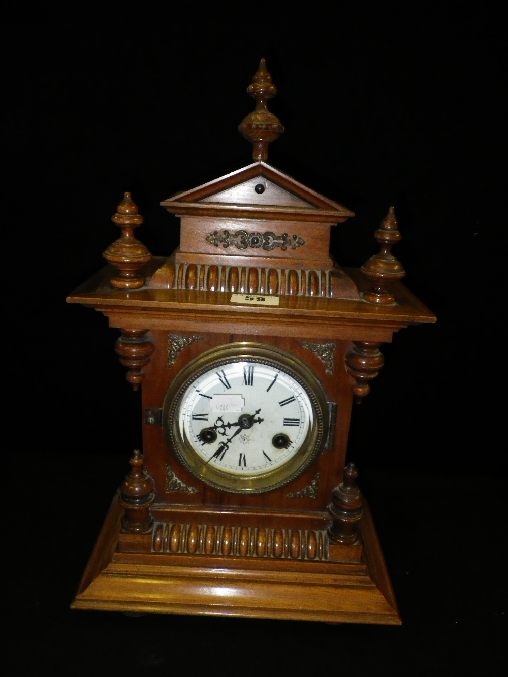 A Victorian walnut cased mantle clock