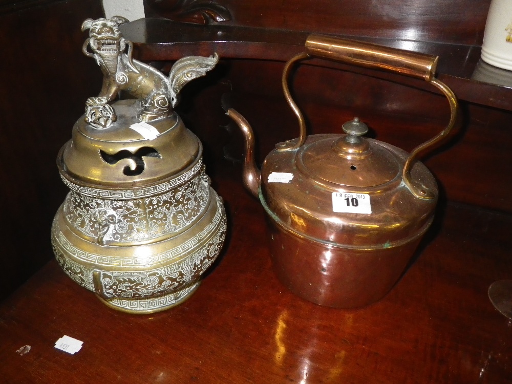 An Oriental brass censer decorated with a Dog of Fo, and a copper kettle