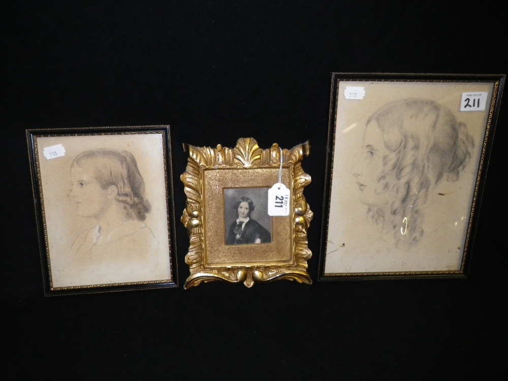 A portrait of a young girl in a gilt frame and two similar pencil portraits