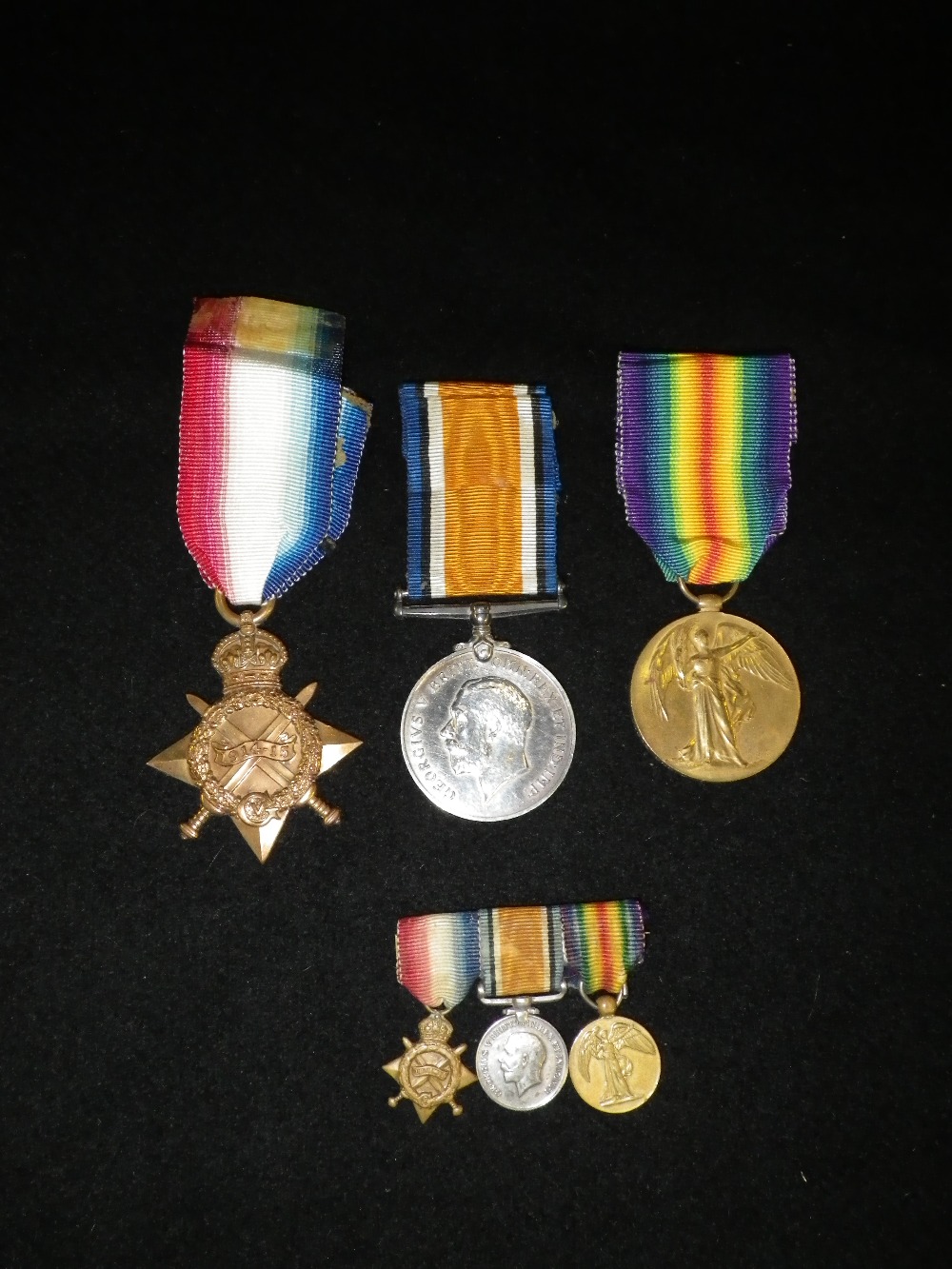 A First World War Trio, awarded to Gunner M.J. Franklin R.F.A. and miniatures