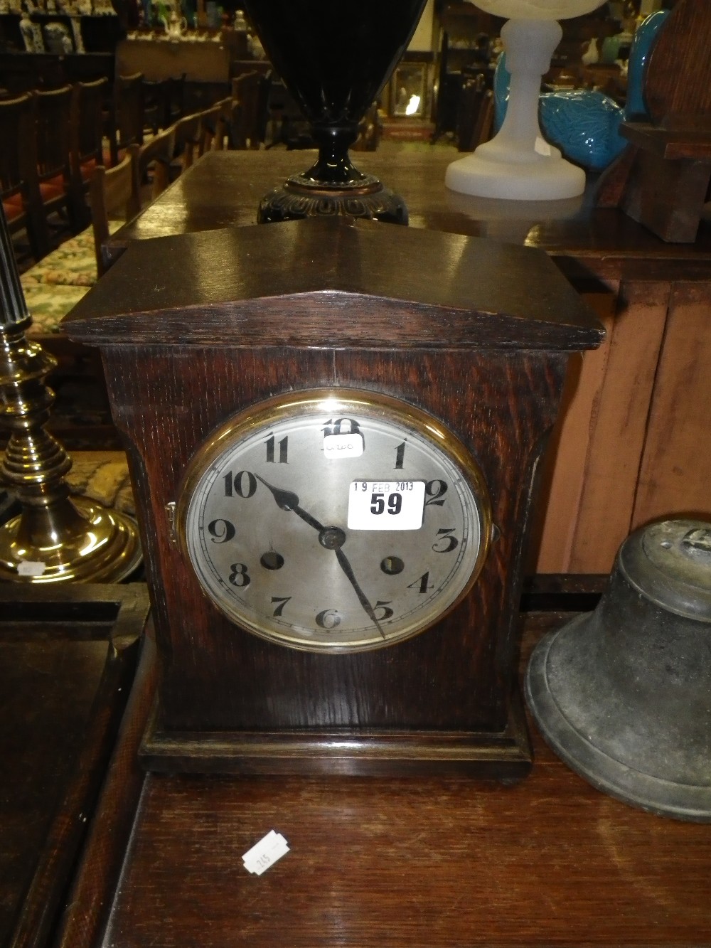 An Edwardian oak cased mantel clock