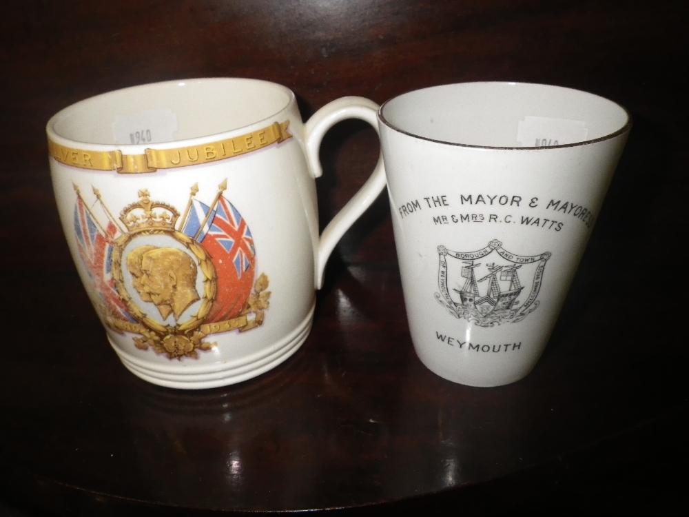 A 1911 Coronation mug from Weymouth and another similar