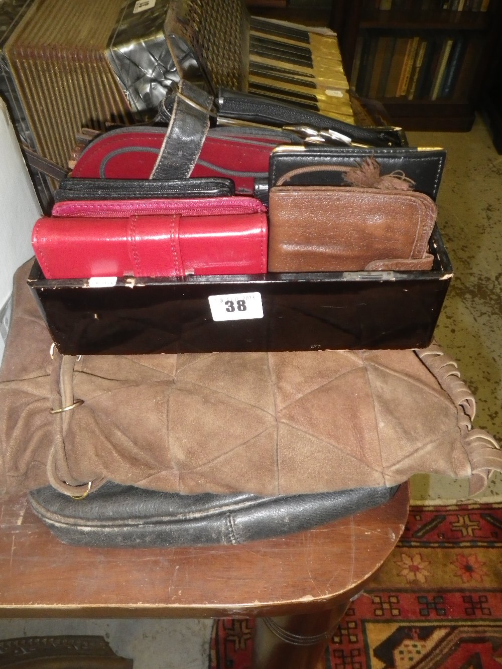 A collection of vintage ladies purses and two leather handbags