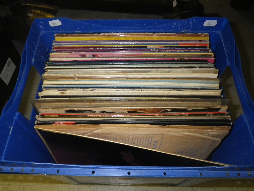 A collection of LP records including The Beatles, The Rolling Stones, Noel Coward, Mrs Mills, and