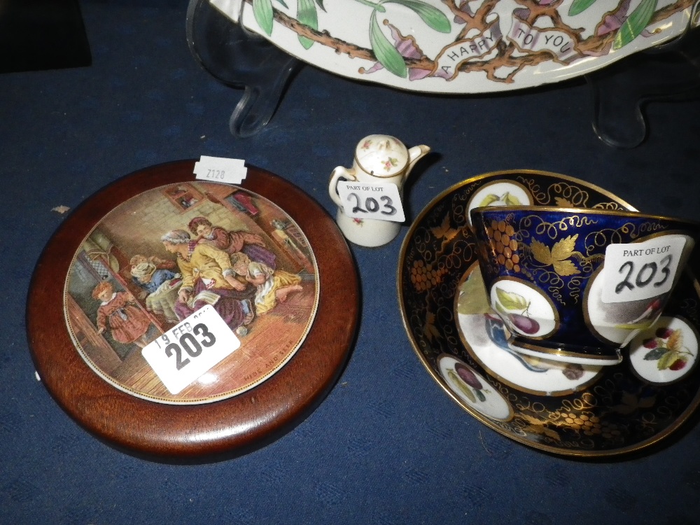 A Victorian Prattware pot lid `Hide and Seek`, an early 19th century cup and saucer and a