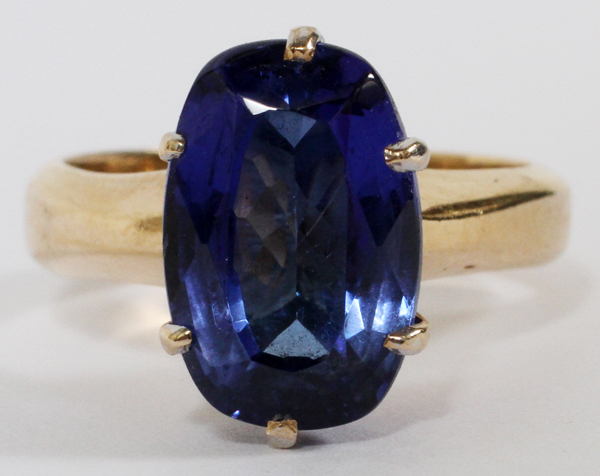 14 KT YELLOW AND WHITE GOLD AND TANZANITE, LADY`S RING, SIZE 6.5: having a large oval cut
