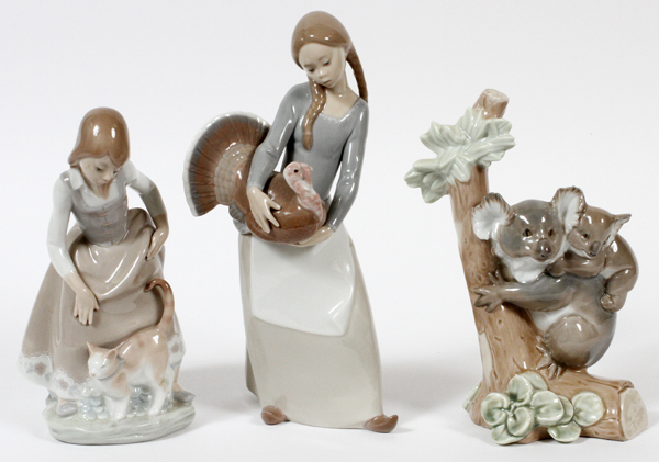 LLADRO PORCELAIN FIGURES, THREE: Including 1 koala, 1 girl with cat, and 1 girl with turkey.
