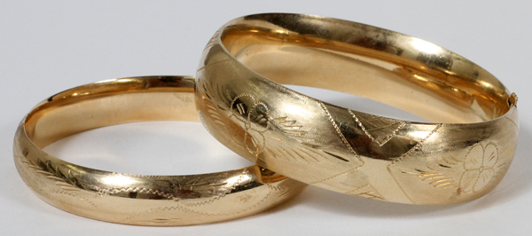 GOLD BANGLE BRACELETS 2PCS.: 14kt yellow etched with floral designs; total wt 36.6 grms. Both