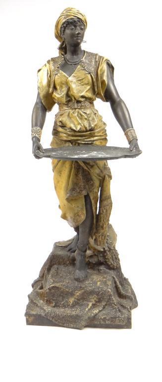 Large painted spelter figure of a Nubian female clutching a card tray, 108cm high : For Condition