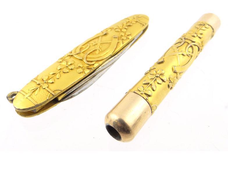 Gilt brass and gold coloured metal coloured cased propelling pencil together with a gilt brass