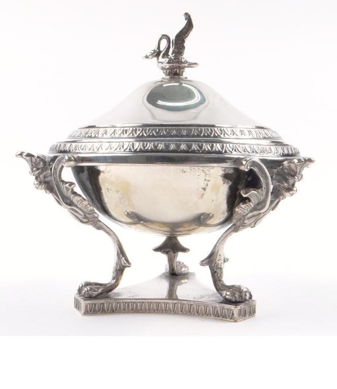 800 grade silver bowl and cover raised on a tricorn base with lion mask supports and bird finial,