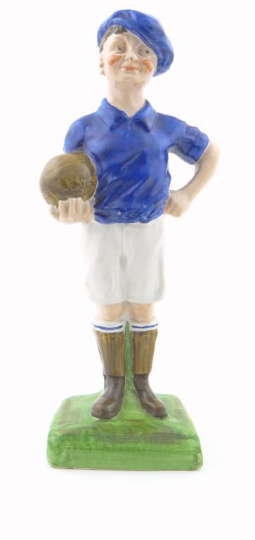 Staffordshire Pottery figure of a football player with hand painted decoration, 37cm high : For