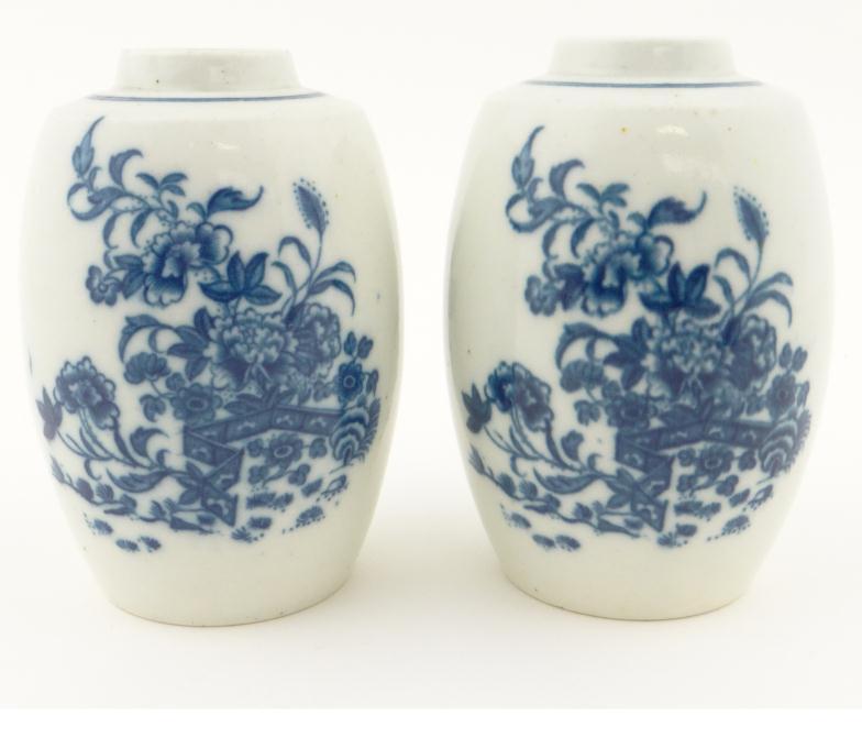 Pair of 18th century Worcester style caddies, each decorated in blue with chinoiserie style flowers,