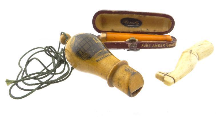 Mauchlin whistle decorated with Shakespeare`s House, a cased amber cheroot with 9ct gold mount and a