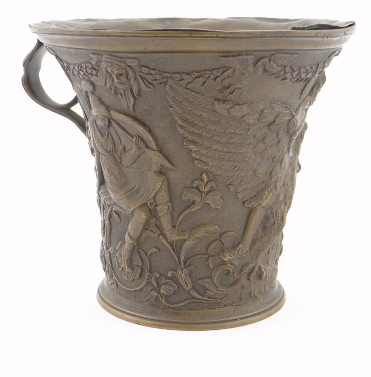 Continental bronzed metal cup of flared form decorated in relief with classical figures and an