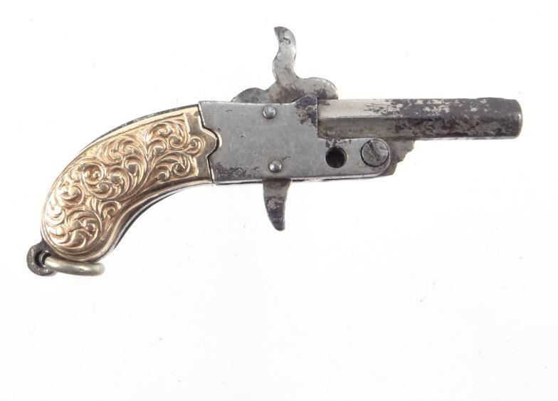 Miniature pistol watch key with chased gold coloured metal mounts, 3cm in length : For Condition