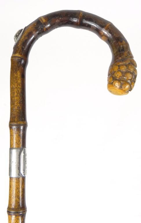 Simulated bamboo walking cane with pencil enclosed in the shaft, the silver collar hallmarked London