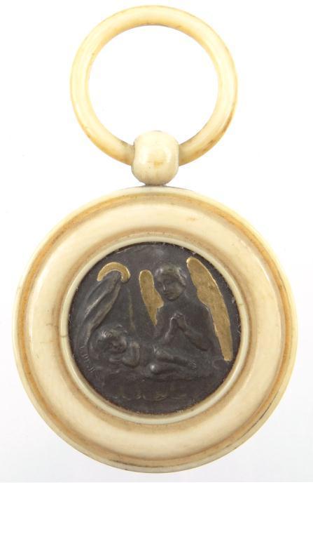 Antique ivory baby`s teething ring set with a central metal panel depicting the Madonna and child