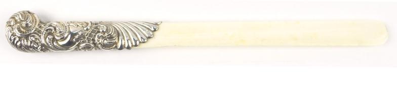 Antique silver handled ivory page turner, the handle with embossed decoration, indistinctly