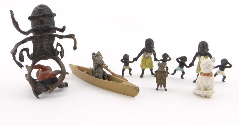 Collection of miniature cold painted bronze and metal figures including two black family groups, a