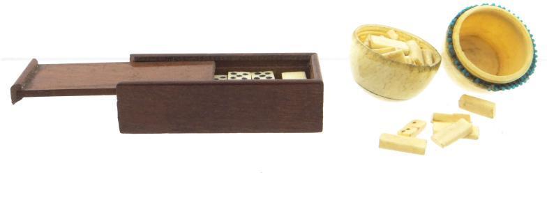 Two groups of miniature bone dominoes housed in a mahogany case and an egg shaped composition