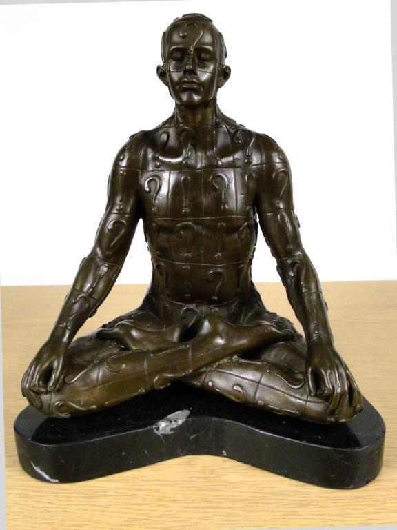Bronzed study of a figure seated in the lotus position raised on a marble base : For Condition