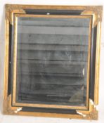 A Regency style contemporary gilt and ebonised framed wall mirror having bevelled glass with back