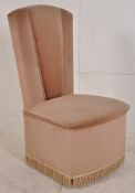 A 1930's Art Deco upholstered bedroom chair having velour finish with fan shaped back rest