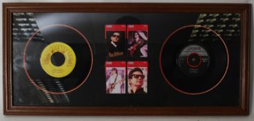 A framed and glazed Roy Orbison presentation display, with Chinese phone cards alongside a Rock