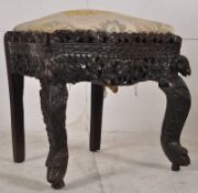 A 19th century Anglo - Indian carved hardwood, possibly Padouk or Rosewood opium chair. The carved