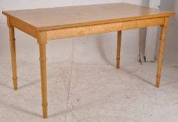 A good quality solid oak dining table being raised on turned legs with rectangular table top