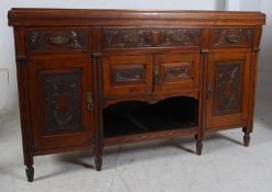 Edwardian walnut dresser base / sideboard. The carved doors and drawers to the front with reeded