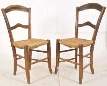 A pair of 19th century provincial French rattan weave kitchen country dining chairs. The square legs