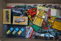 A quantity of vintage toy diecast cars and other vehicles.