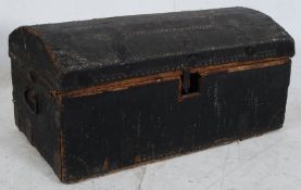 A Victorian dome top trunk being studded with leather covers having hinged top with open storage