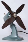 A retro Progress desktop industrial style fan, with rubber blades.
