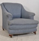 A 1920's chesterfield armchair in the Howard style. The deep and wide frame upholstered in a blue